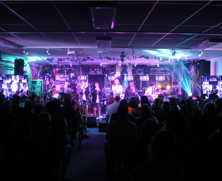 Group of senior students conducting a musical showcase